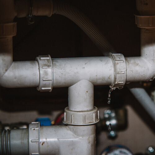 Leakage Of Water From Pipe on home background